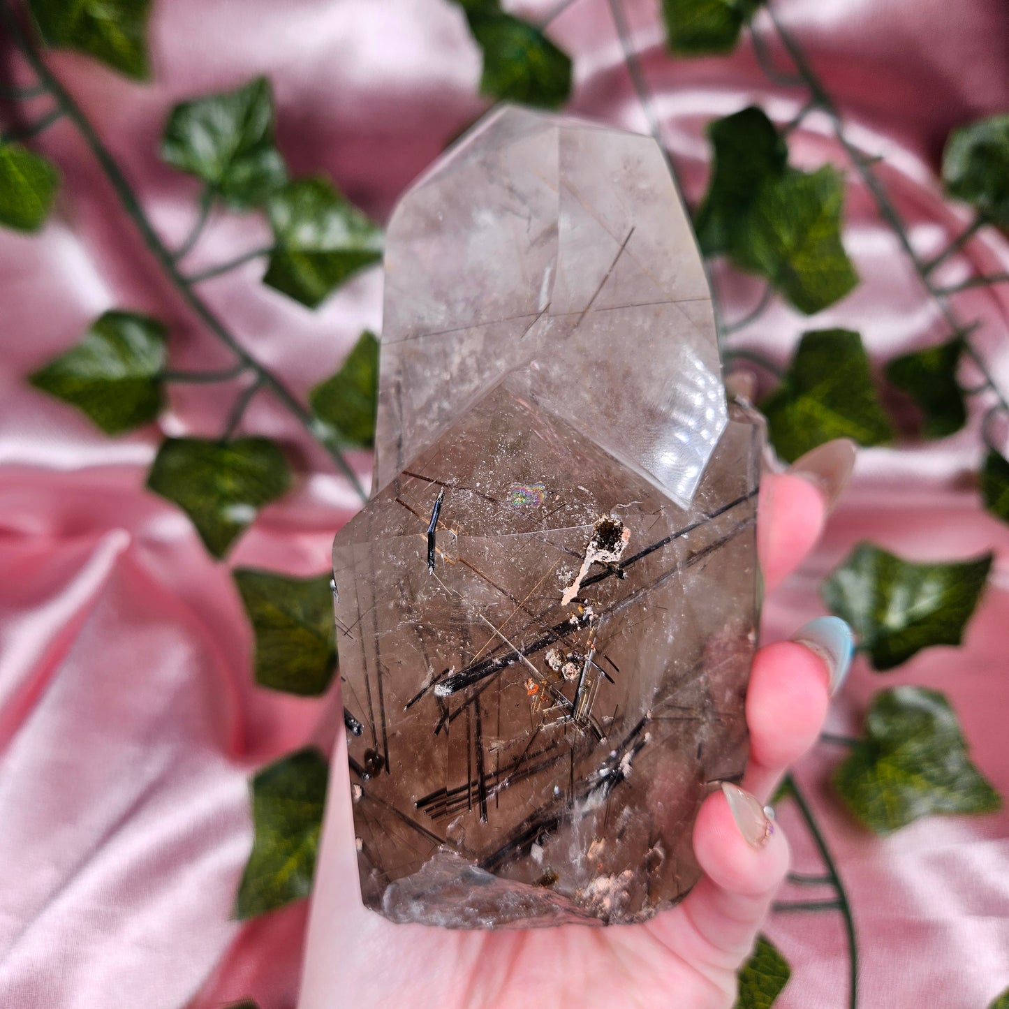 Black tourmaline & rutile in quartz on a stand