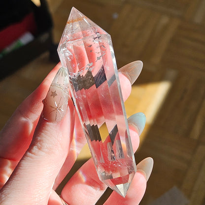 Rainbow clear quartz Vogel on a stand