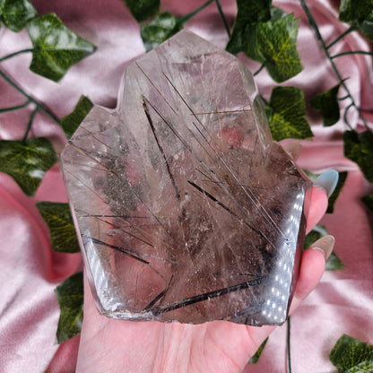 Black tourmaline & rutile in quartz on a stand