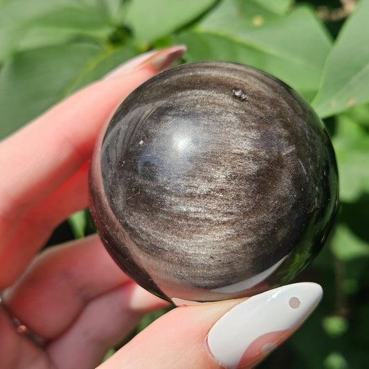 Silver sheen obsidian sphere