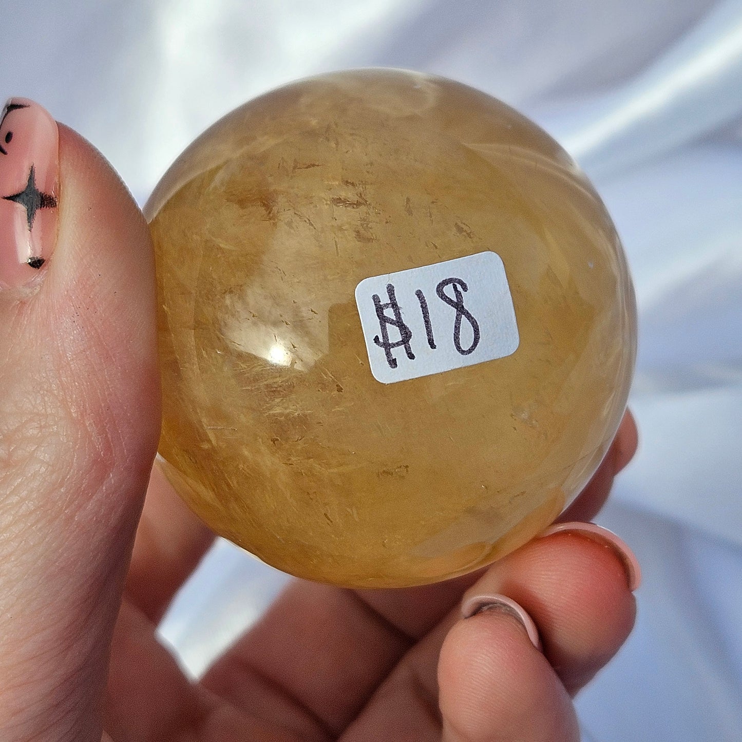 Optical honey calcite sphere