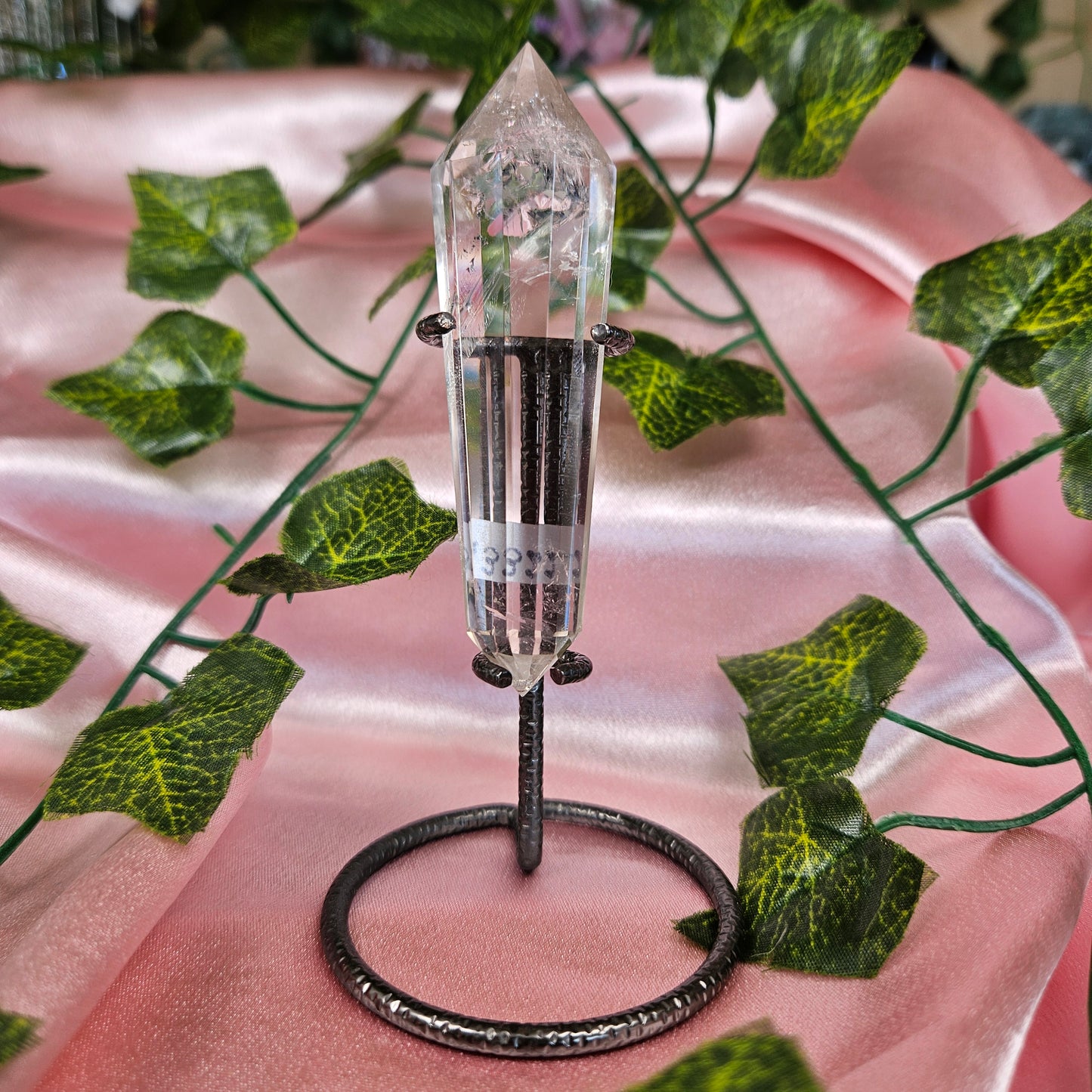 Rainbow clear quartz Vogel on a stand