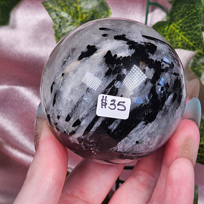 Black tourmaline in quartz sphere