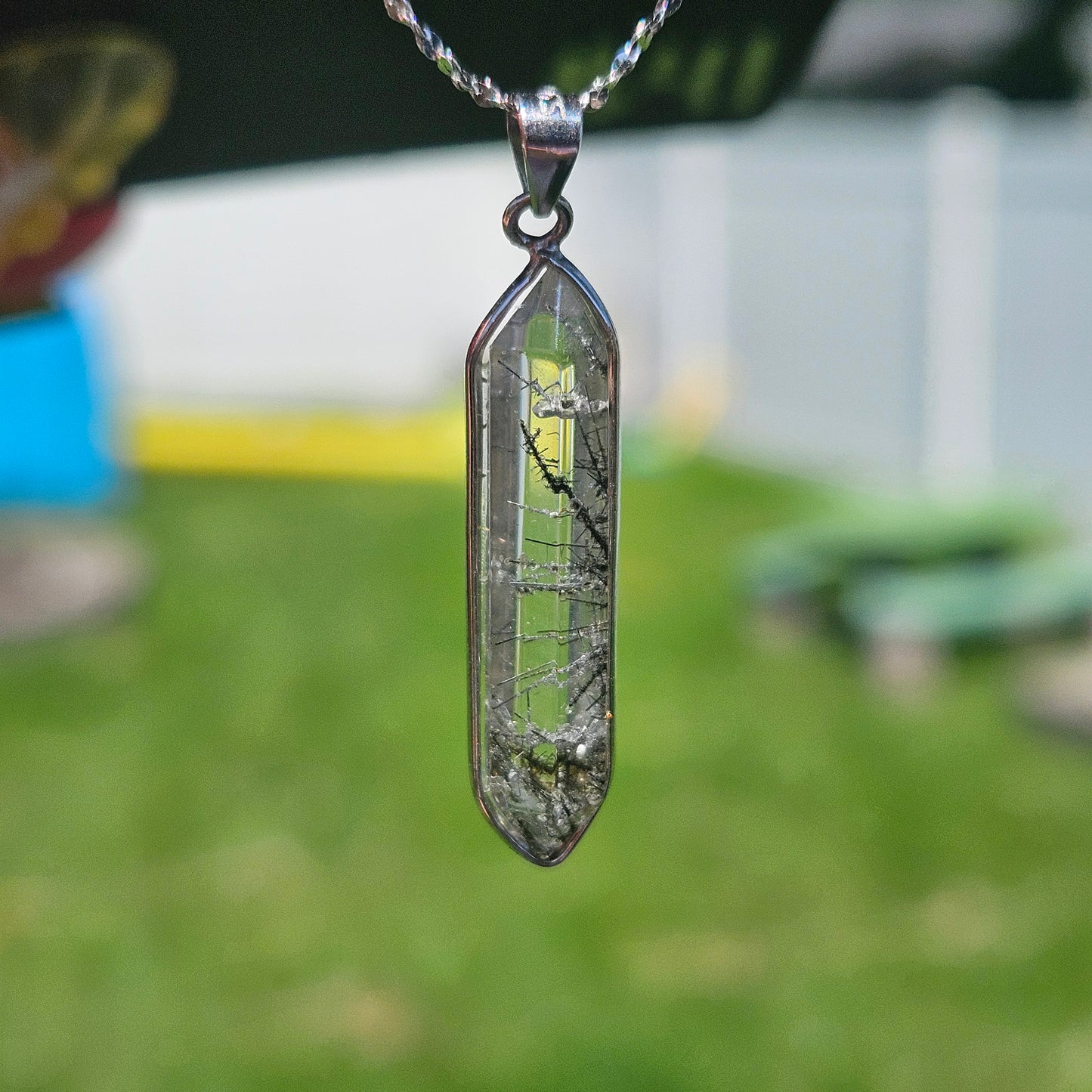 Black tourmaline in quartz pendent