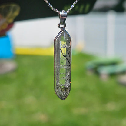 Black tourmaline in quartz pendent