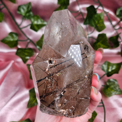 Black tourmaline & rutile in quartz on a stand
