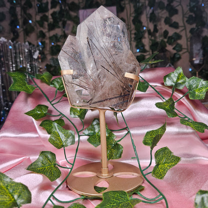 Black tourmaline & rutile in quartz on a stand