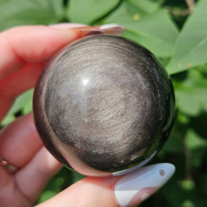 Silver sheen obsidian sphere