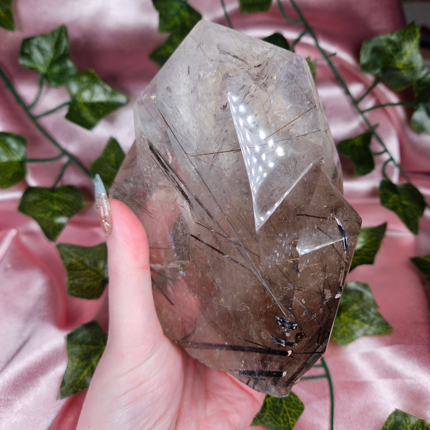 Black tourmaline & rutile in quartz on a stand