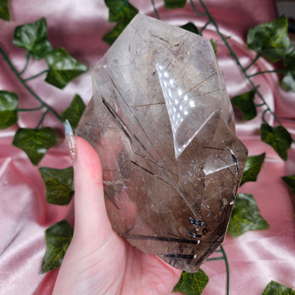 Black tourmaline & rutile in quartz on a stand
