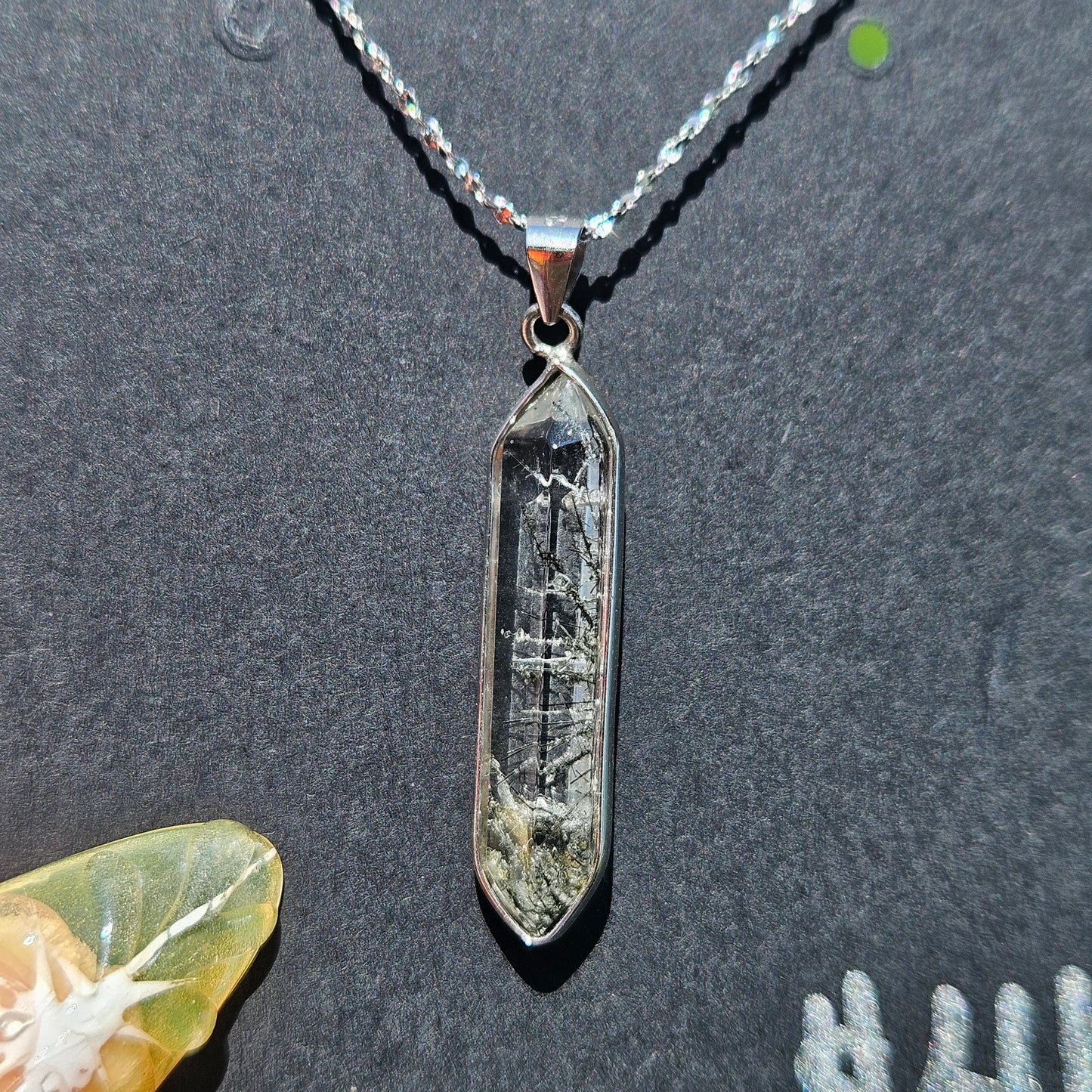 Black tourmaline in quartz pendent