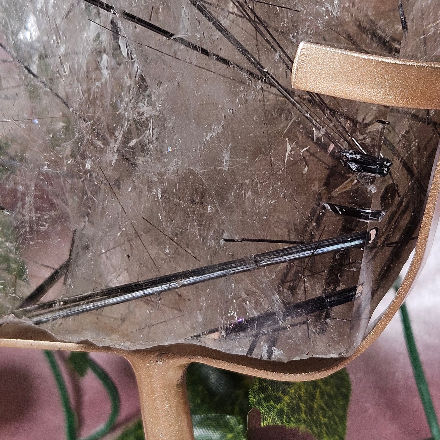Black tourmaline & rutile in quartz on a stand