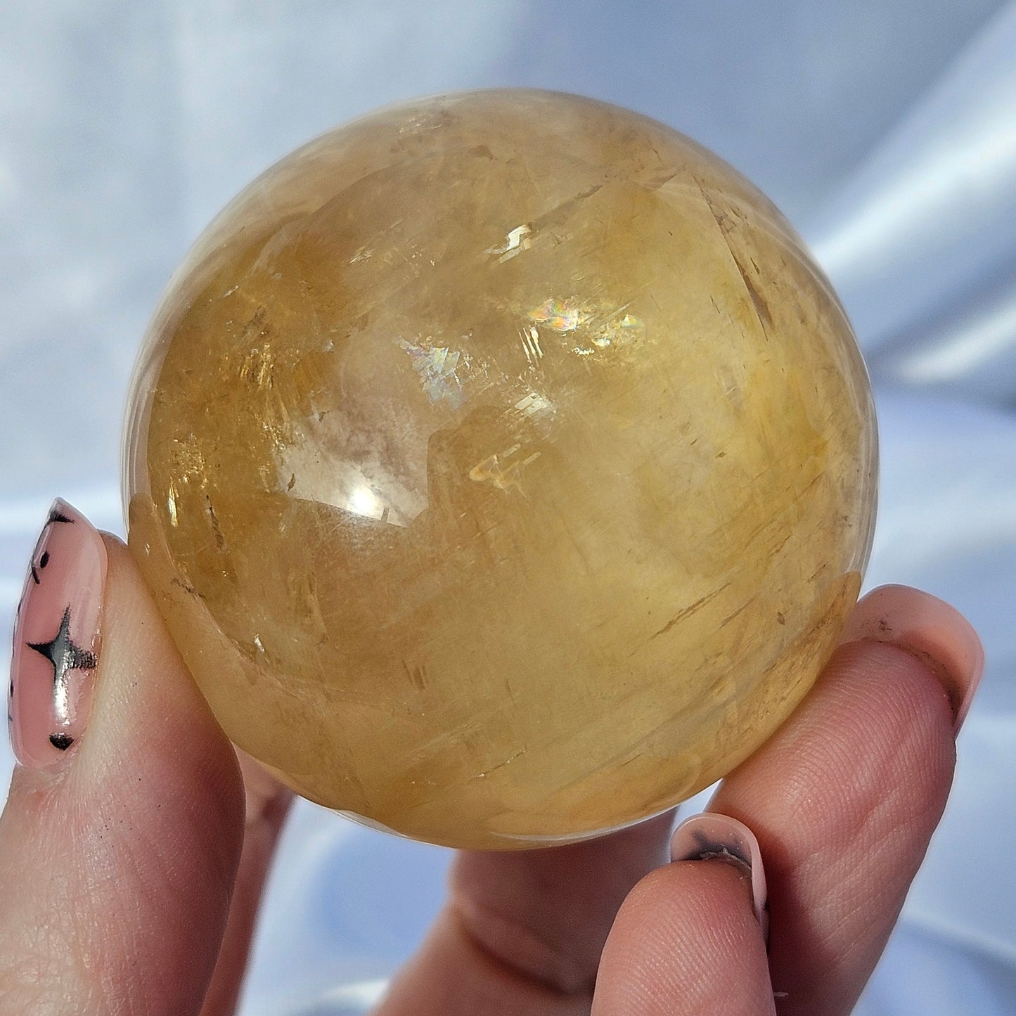 Optical honey calcite sphere