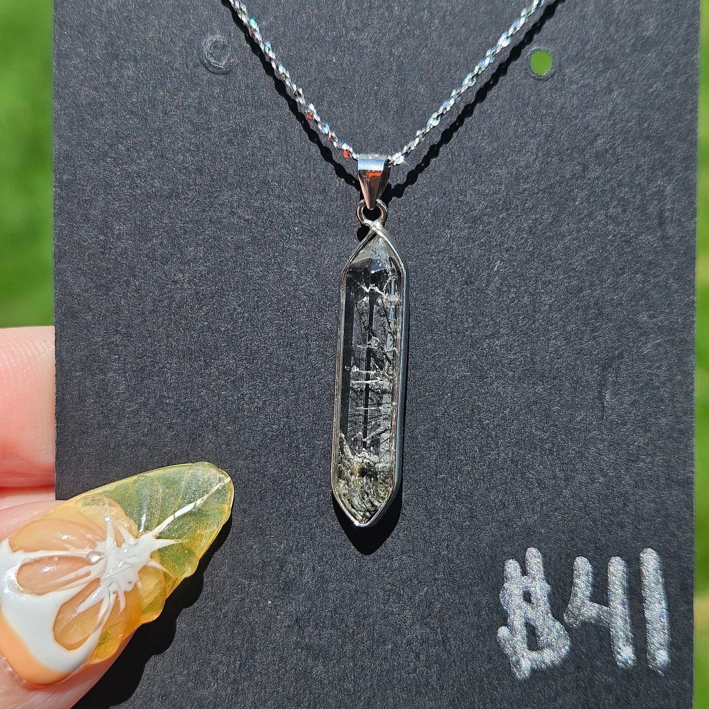 Black tourmaline in quartz pendent