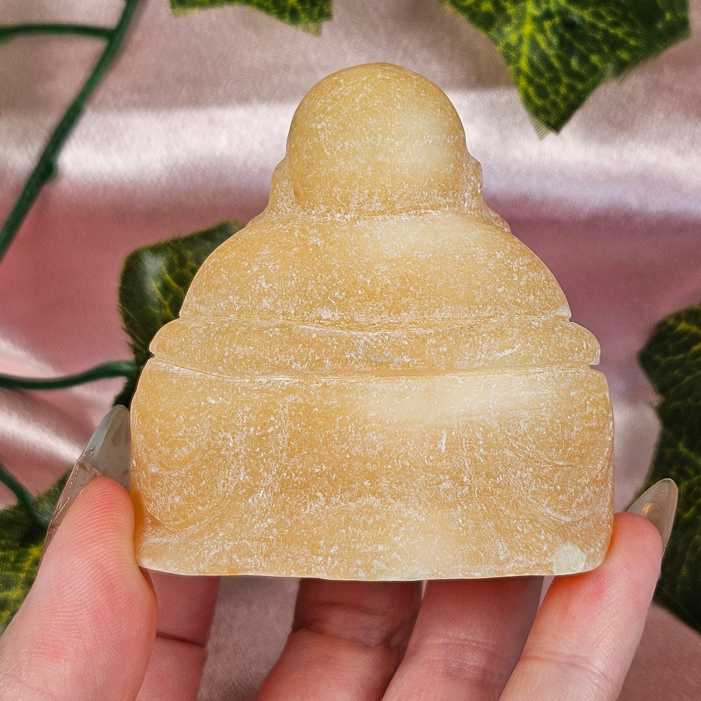 Orange calcite Buddah