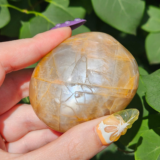 Peach moonstone palm stone